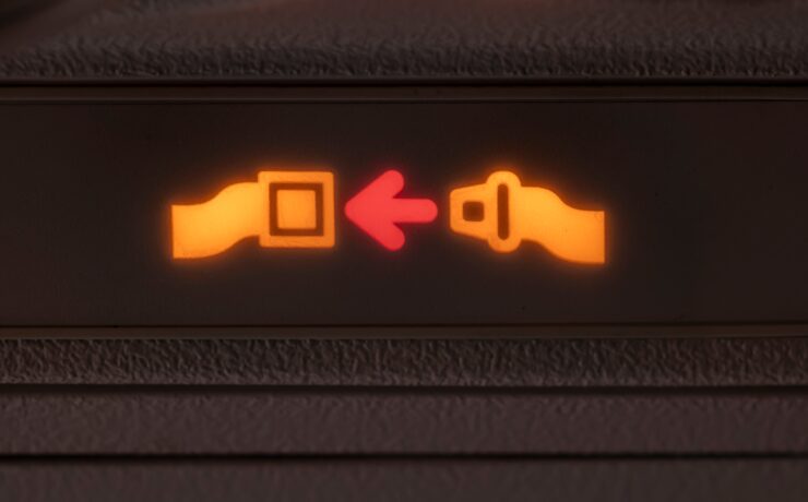a close up of a seat belt sign