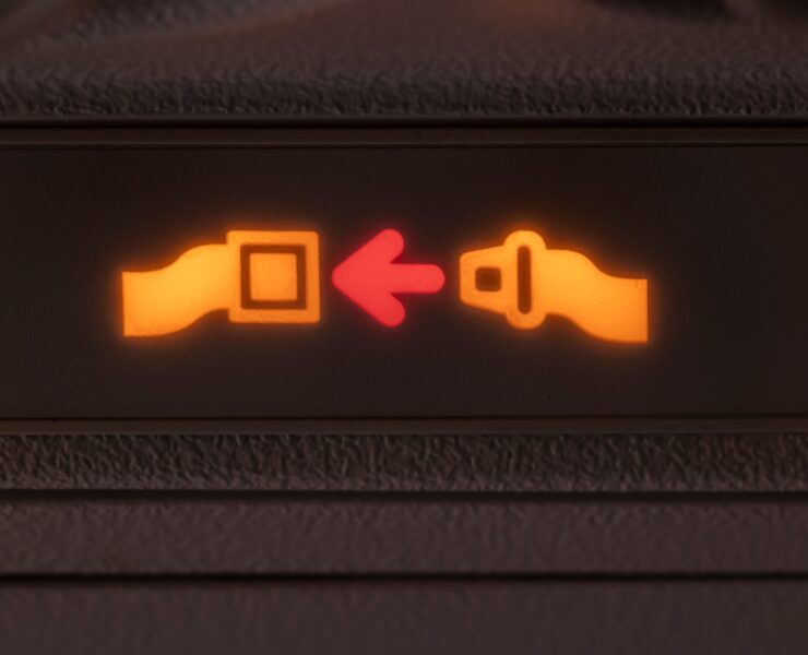 a close up of a seat belt sign
