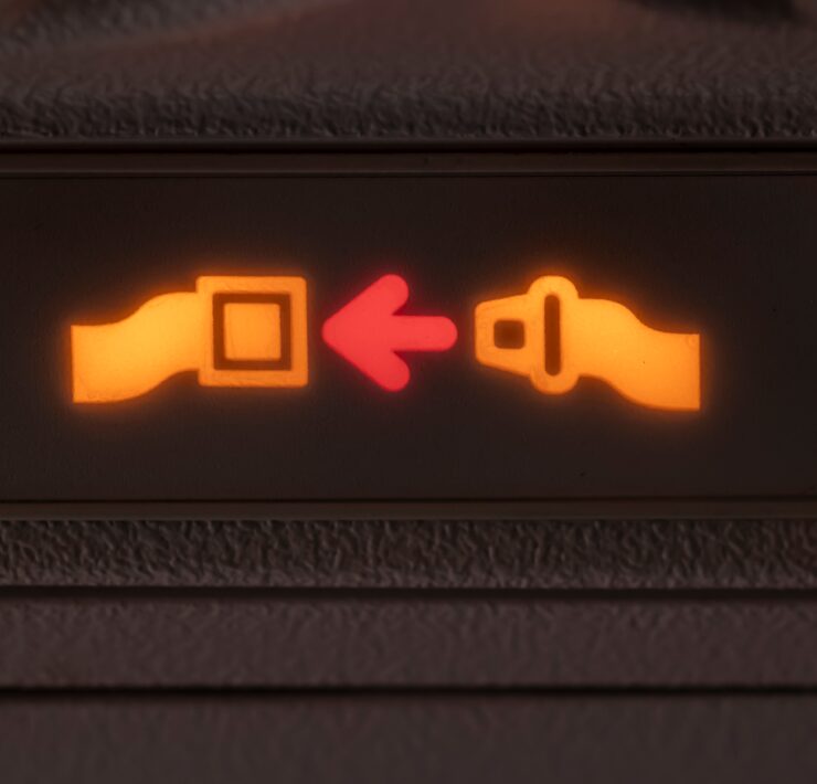 a close up of a seat belt sign