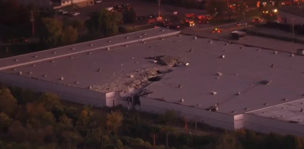 a large hole in the roof of a building