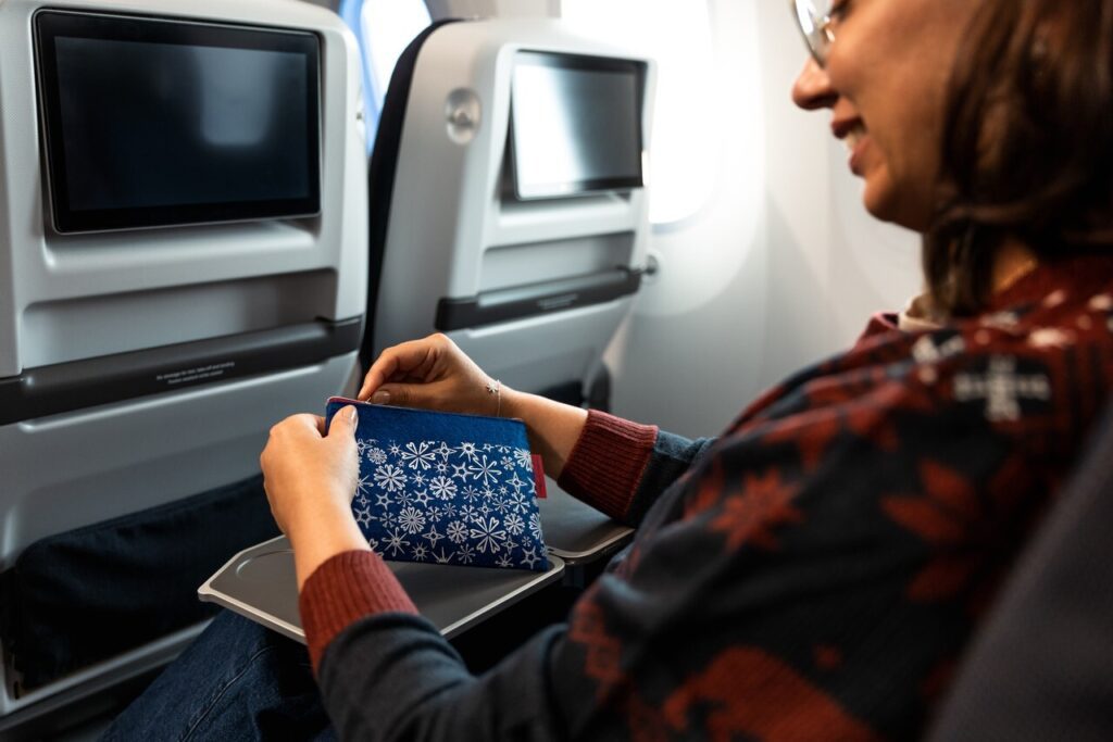 a woman sitting on an airplane