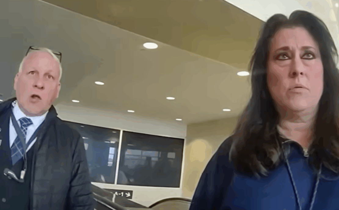 a man and woman standing in a room