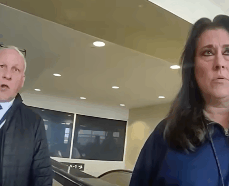 a man and woman standing in a room