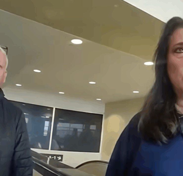 a man and woman standing in a room