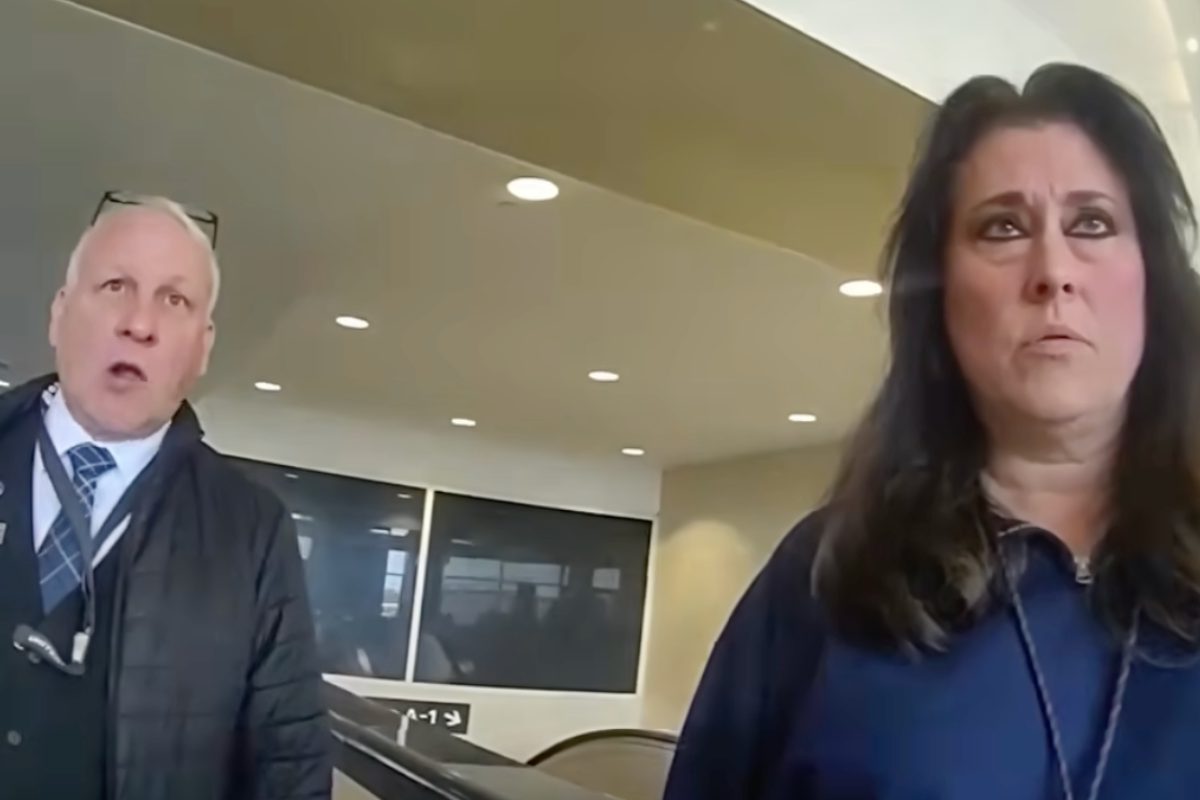 a man and woman standing in a room