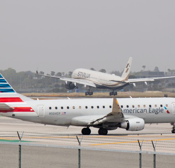 An American Airlines regional jet operated by SkyWest lining up on the runway for takeoff