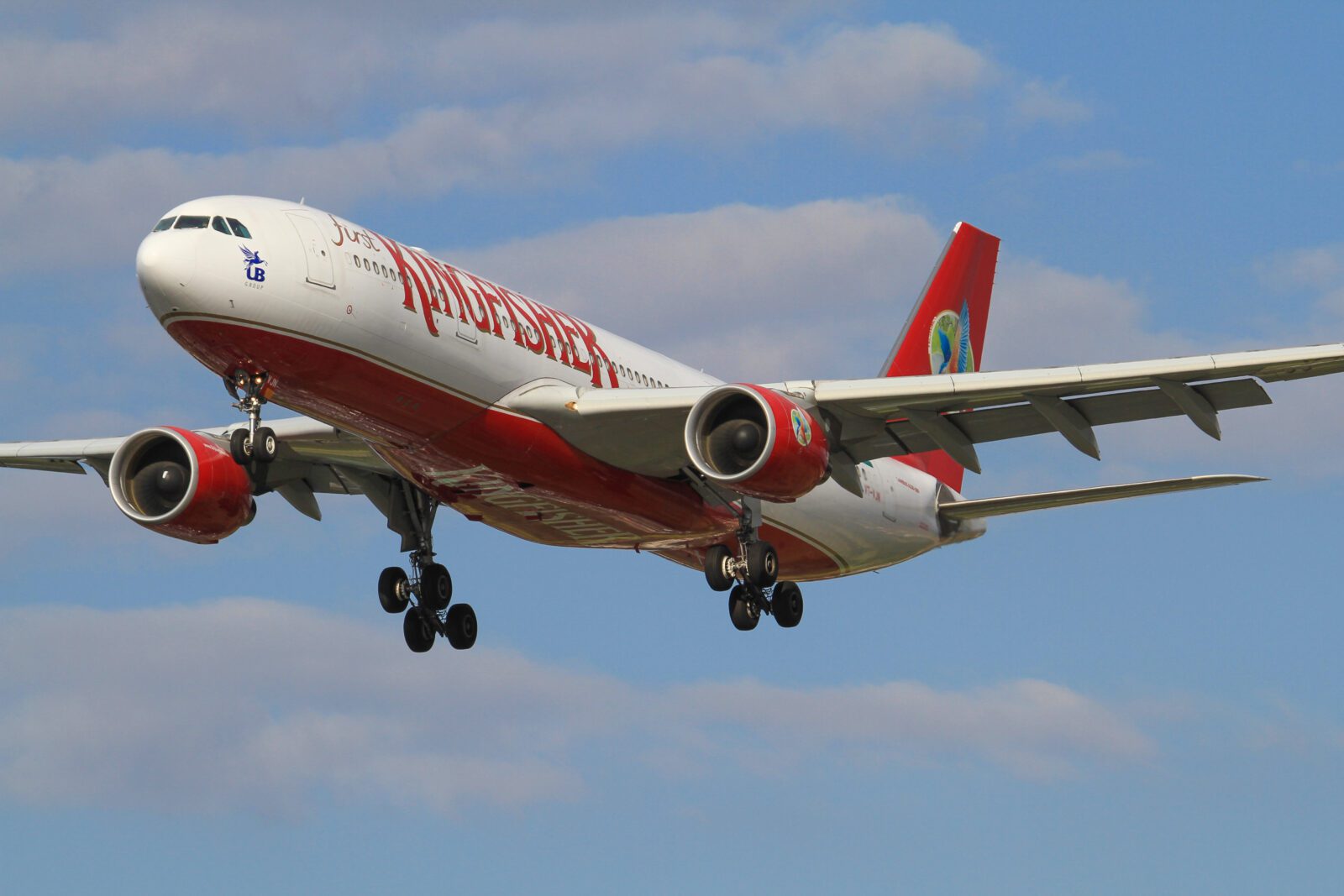 a kingfisher airlines plane flying in the sky