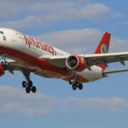 a kingfisher airlines plane flying in the sky