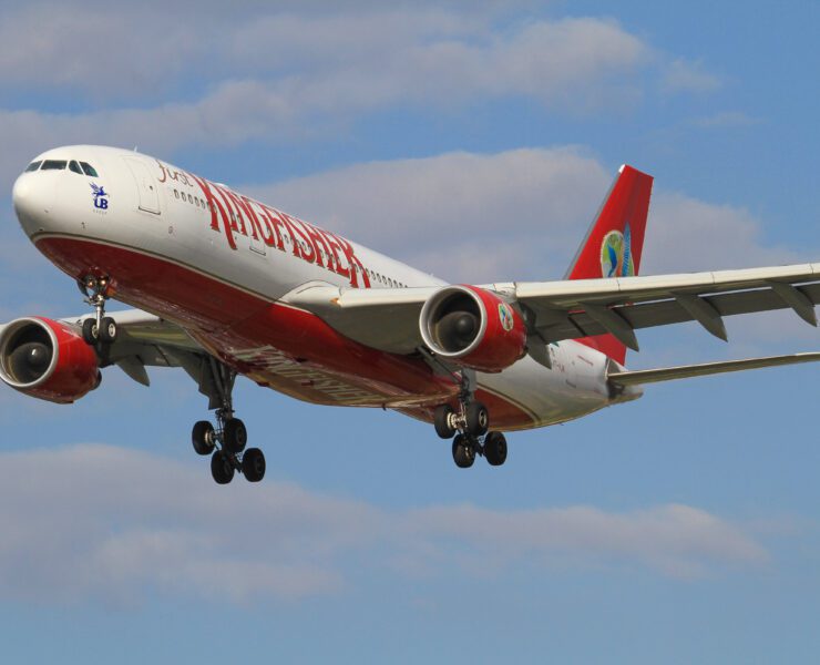 a kingfisher airlines plane flying in the sky