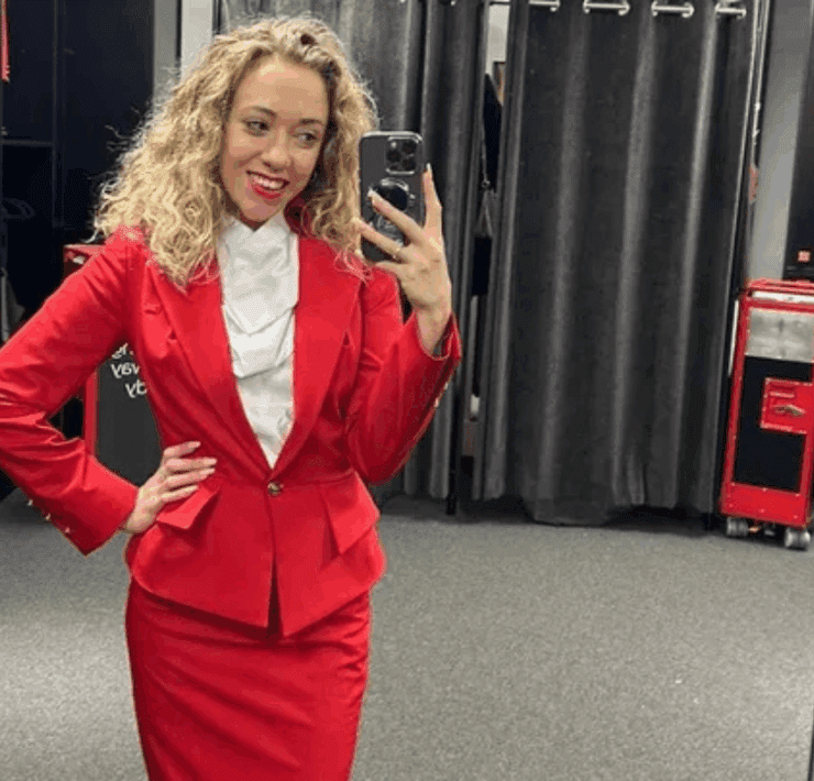 Virgin Atlantic flight attendant Jasmin Winthrop taking a selfie in her uniform