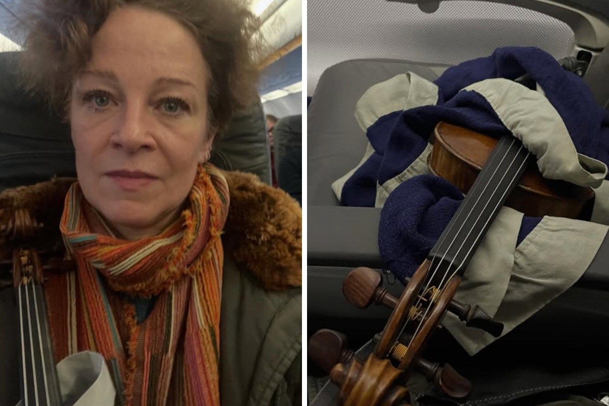 a woman taking a selfie with a violin