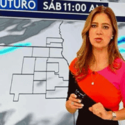 a woman standing in front of a map