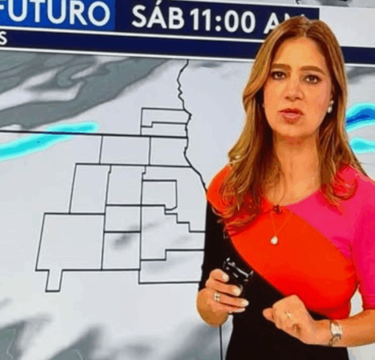 a woman standing in front of a map