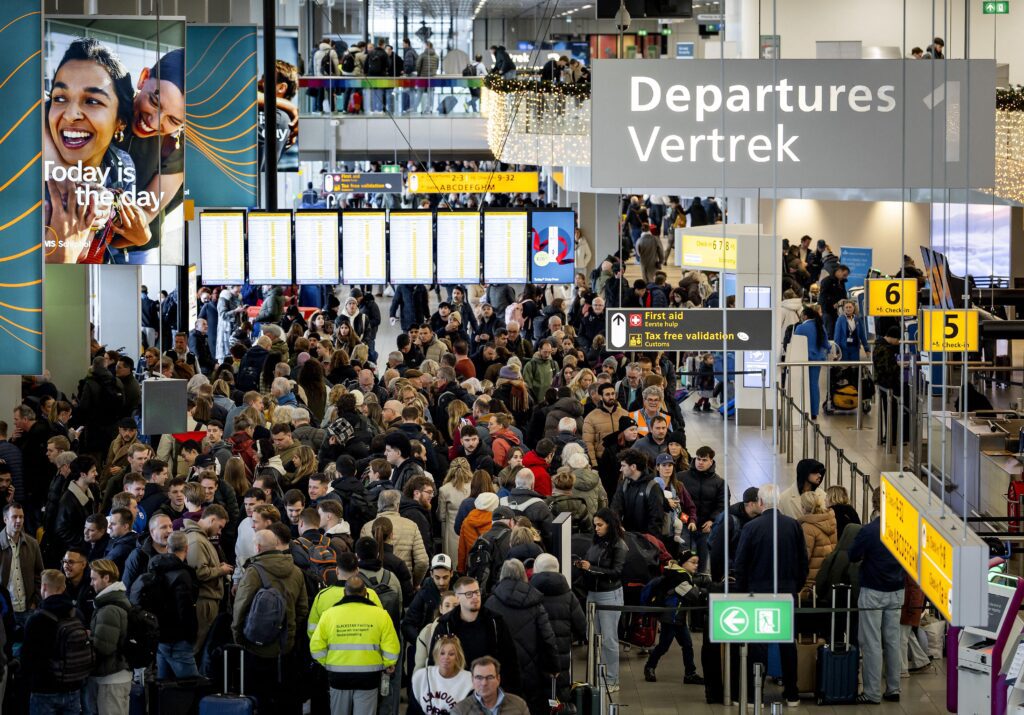 travelers at Schiphol Airport in Amsterdam face massive disruption as severe winter paralyses the airport for the fourt day running