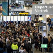 travelers at Schiphol Airport in Amsterdam face massive disruption as severe winter paralyses the airport for the fourt day running