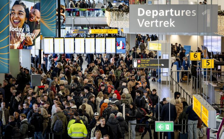travelers at Schiphol Airport in Amsterdam face massive disruption as severe winter paralyses the airport for the fourt day running