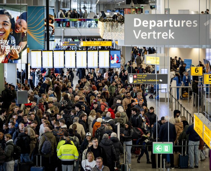 travelers at Schiphol Airport in Amsterdam face massive disruption as severe winter paralyses the airport for the fourt day running