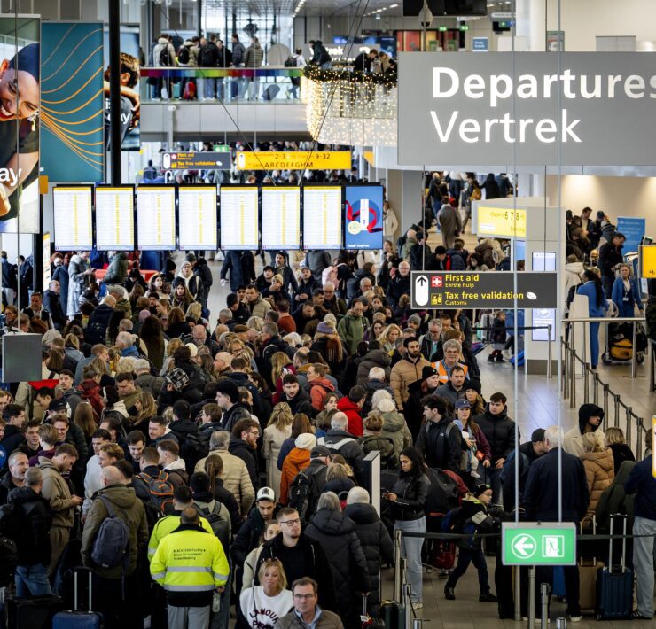 travelers at Schiphol Airport in Amsterdam face massive disruption as severe winter paralyses the airport for the fourt day running
