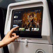 a hand pointing at a screen