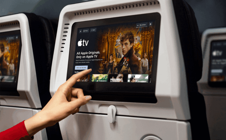 a hand pointing at a screen