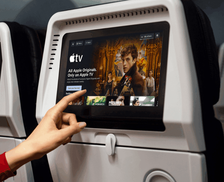 a hand pointing at a screen