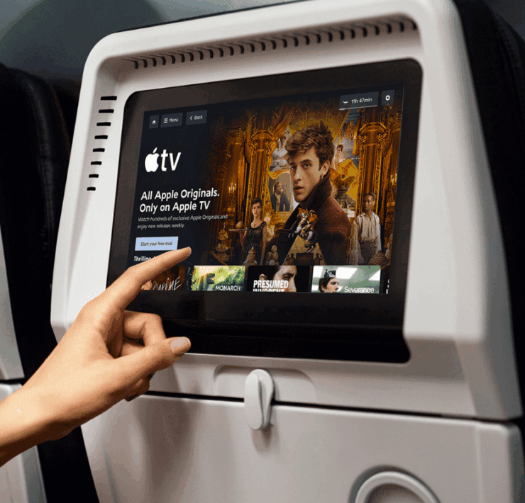 a hand pointing at a screen