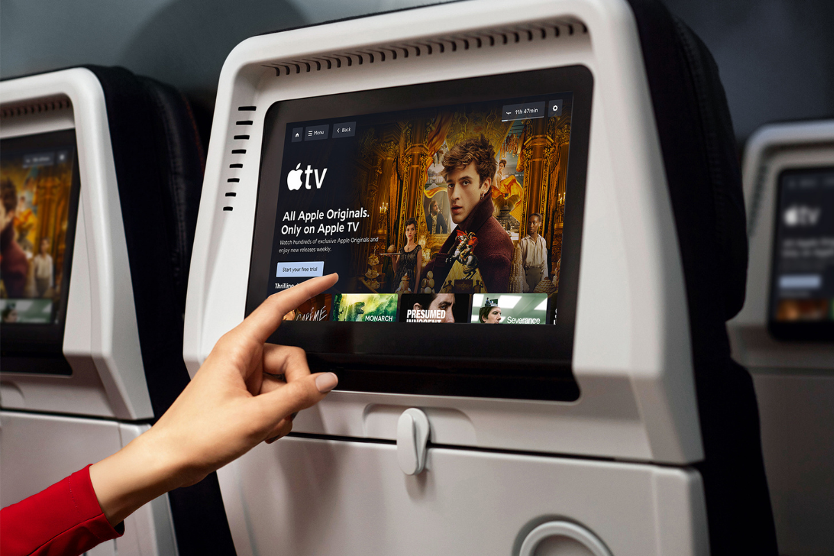 a hand pointing at a screen