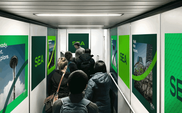 a group of people walking down a hallway