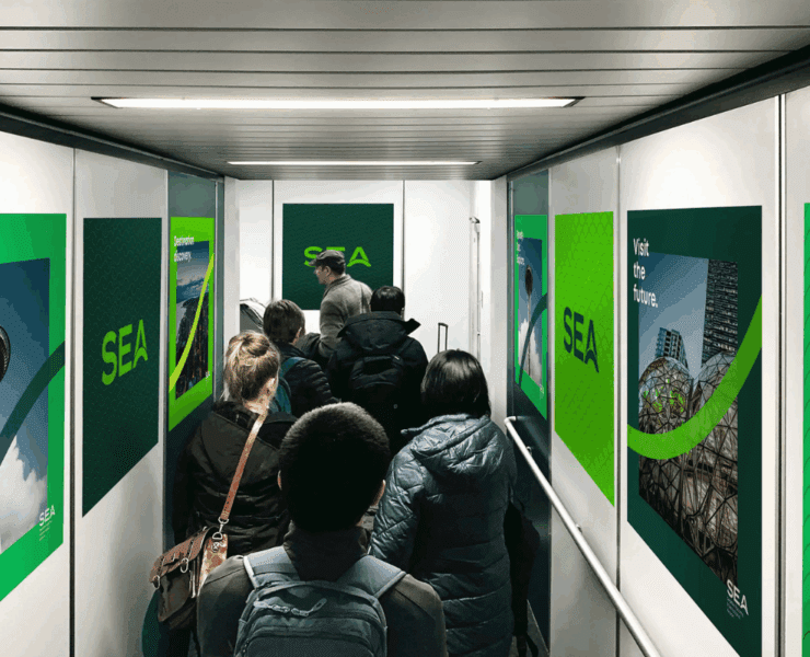 a group of people walking down a hallway