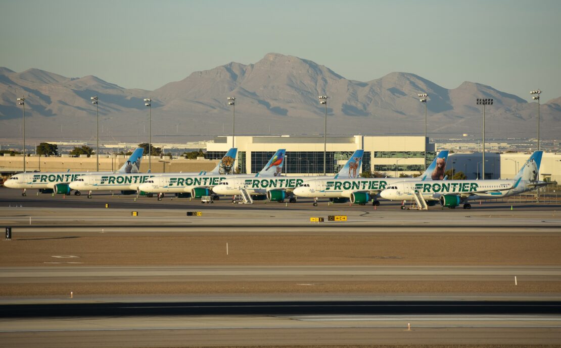 frontier airlines planes parked on the tarmac