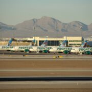 frontier airlines planes parked on the tarmac