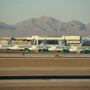 frontier airlines planes parked on the tarmac