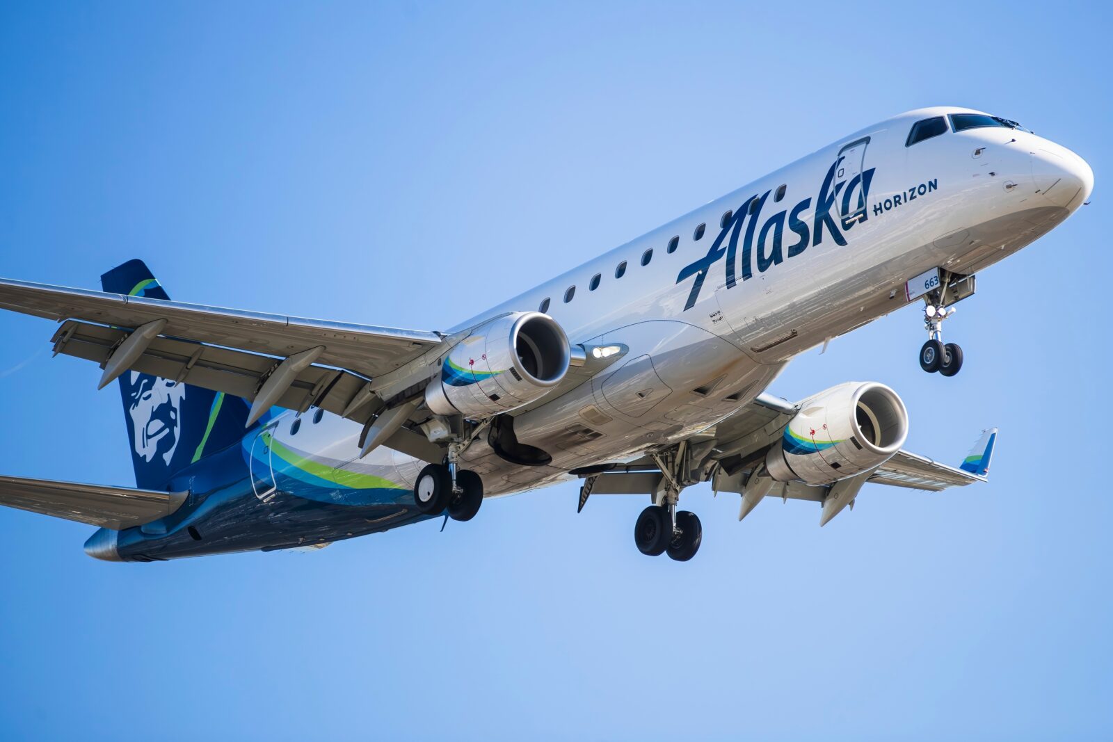 a horizon alaska airlines plane in the sky