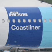 the side of a plane with a blue stripe
