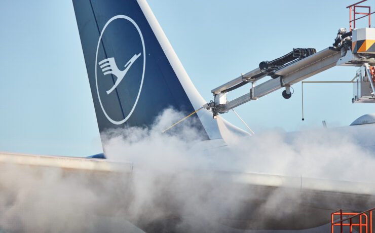 a jet plane with smoke coming out of it