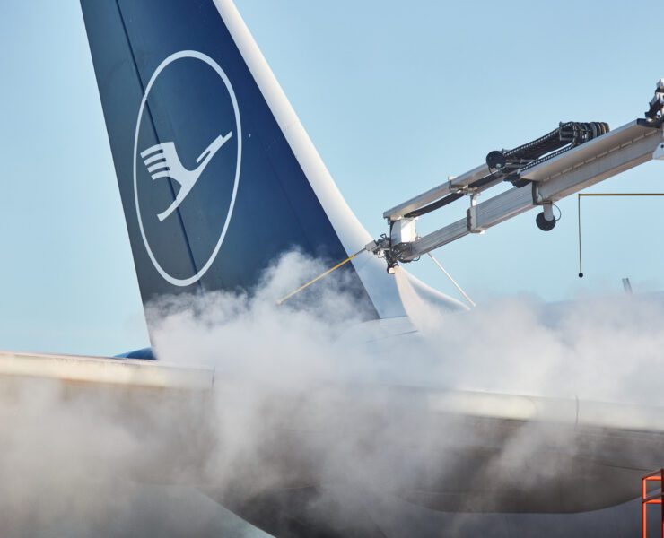 a jet plane with smoke coming out of it