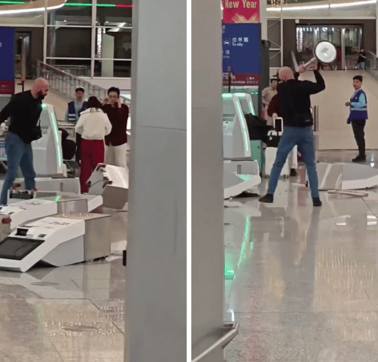 a man holding a silver object in front of a group of people