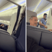 a man sitting in a chair with a woman in a mask