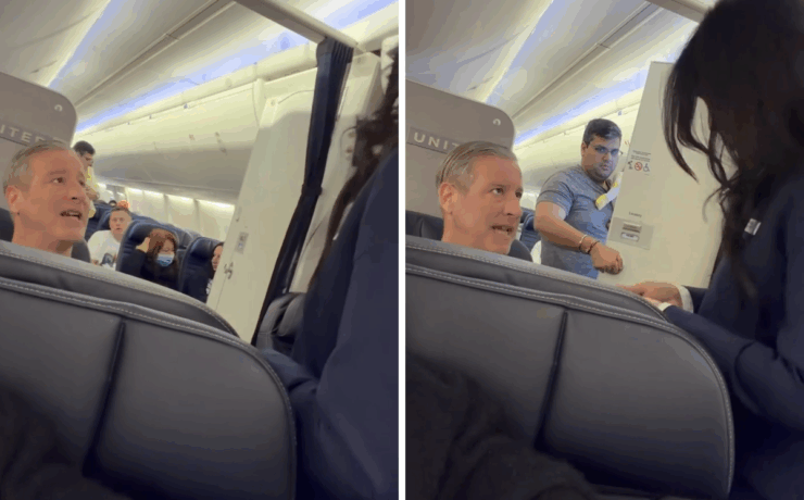 a man sitting in a chair with a woman in a mask