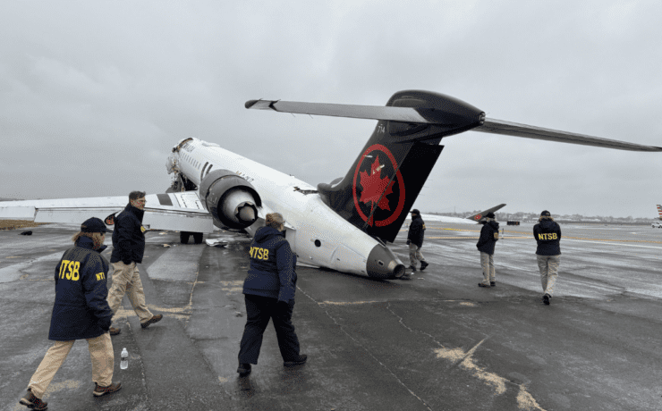 NTSB walk the scenes of crash of Air Canada Express regional jet at LaGuardia Airport