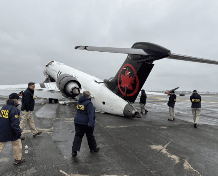 NTSB walk the scenes of crash of Air Canada Express regional jet at LaGuardia Airport