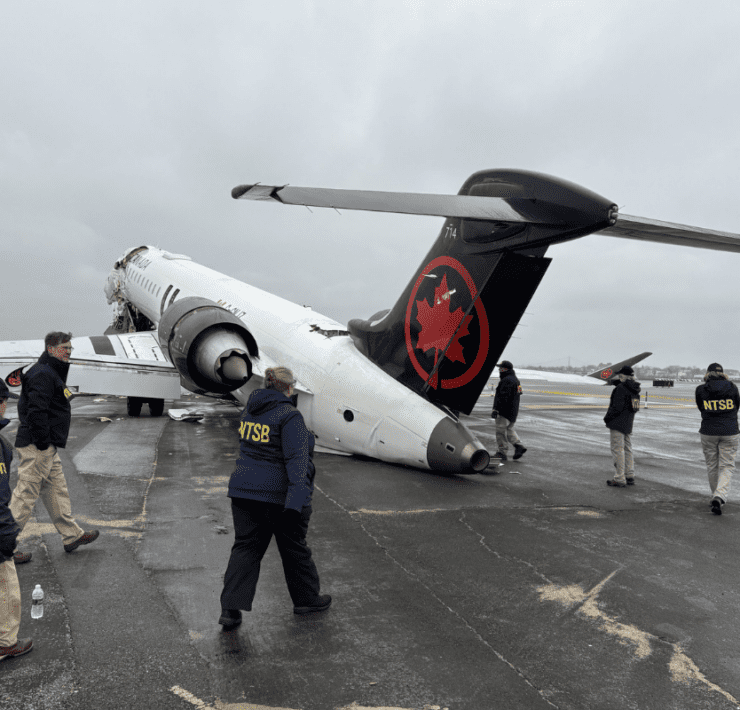 NTSB walk the scenes of crash of Air Canada Express regional jet at LaGuardia Airport