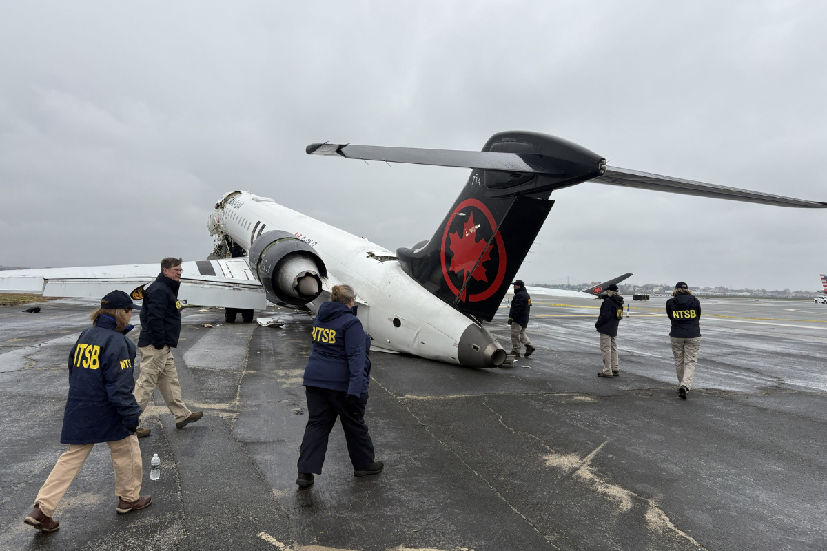 NTSB walk the scenes of crash of Air Canada Express regional jet at LaGuardia Airport