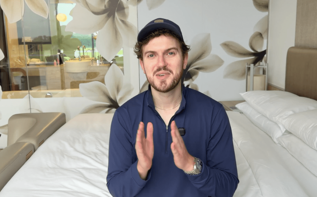 a man sitting on a bed