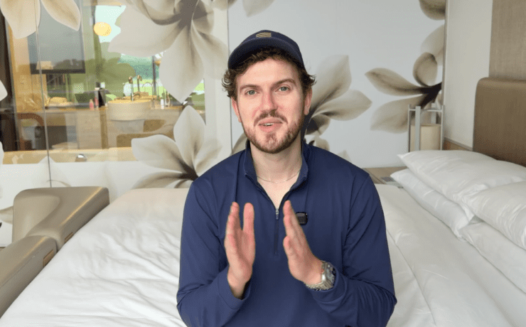 a man sitting on a bed