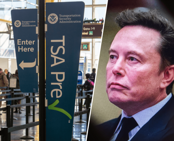 a man in a suit and tie next to a sign