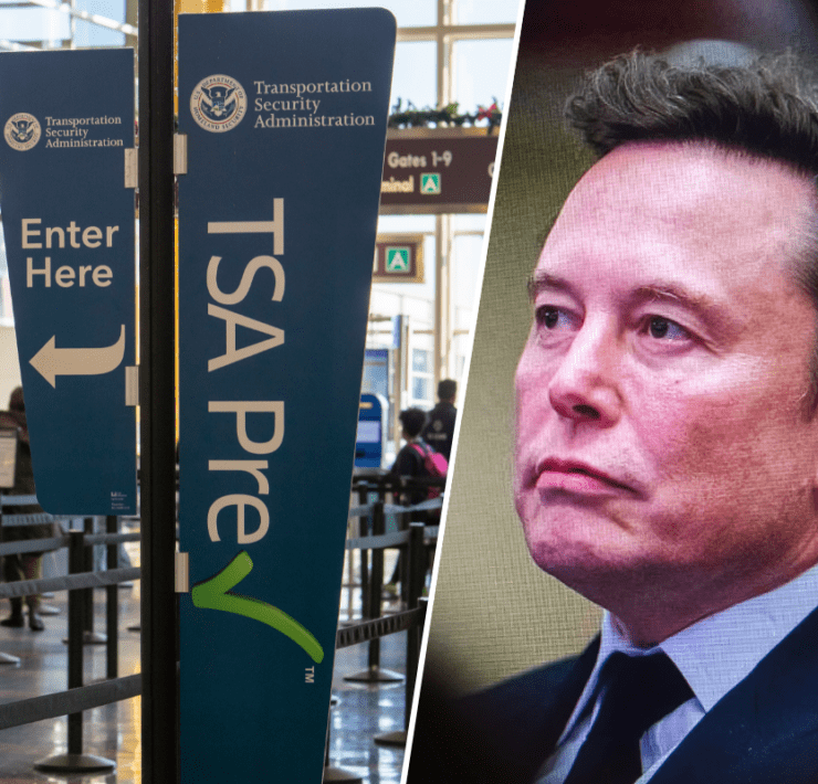 a man in a suit and tie next to a sign