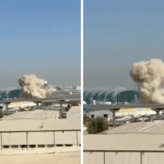 a cloud of smoke coming out of a building