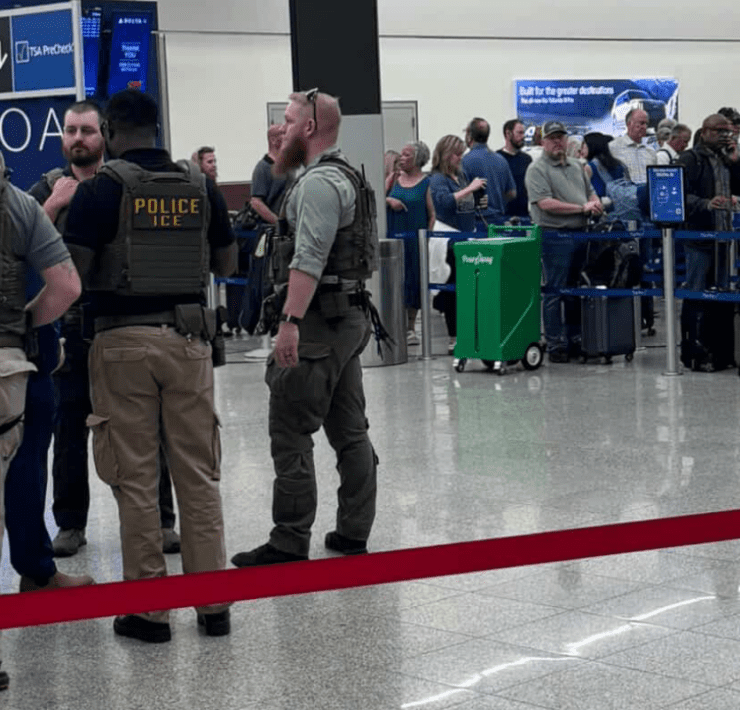 a group of people in a airport