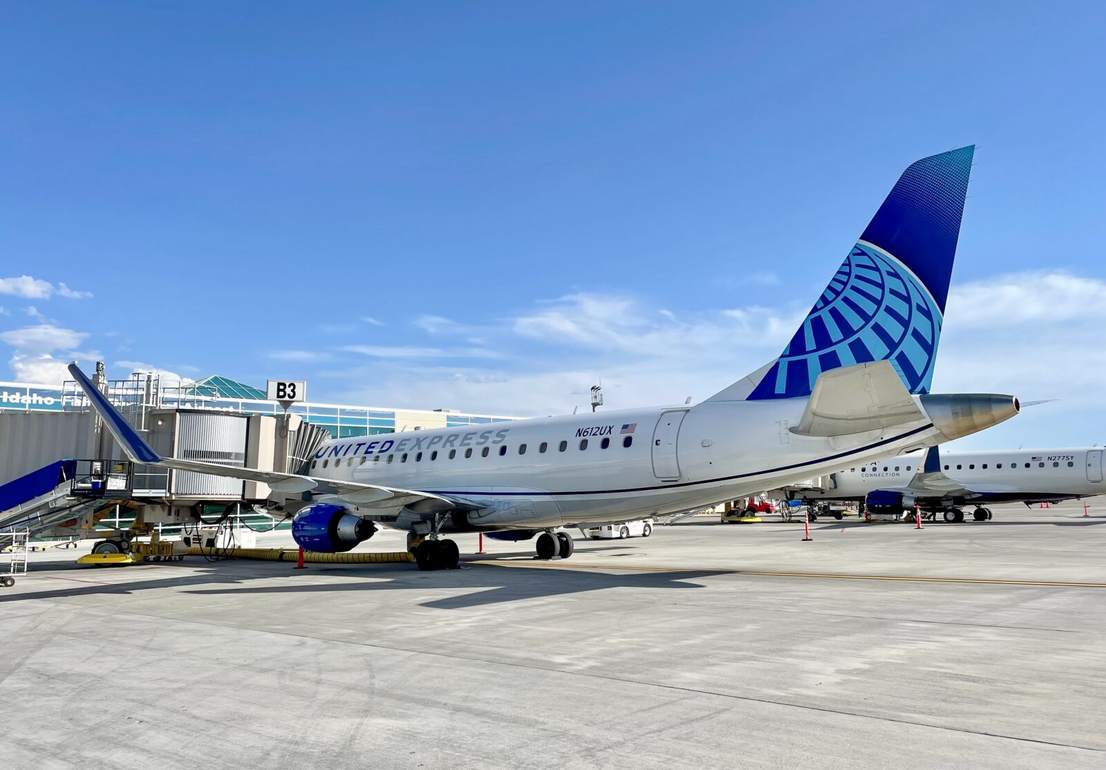 a skywest united express airplane at the gate